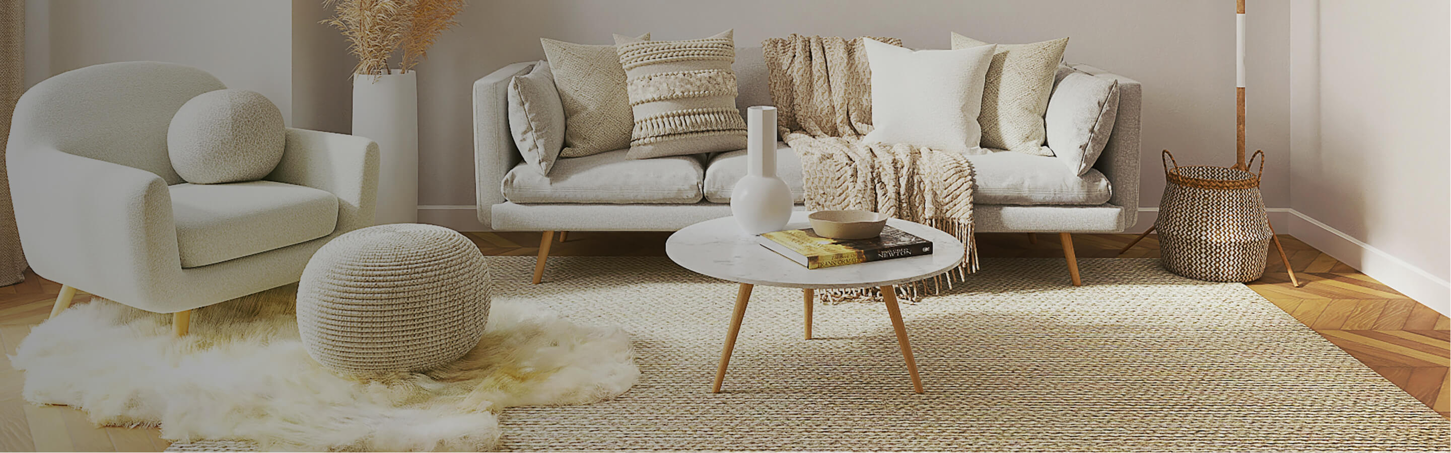 white and beige modern boho living space with natural rug and chevron wood floors